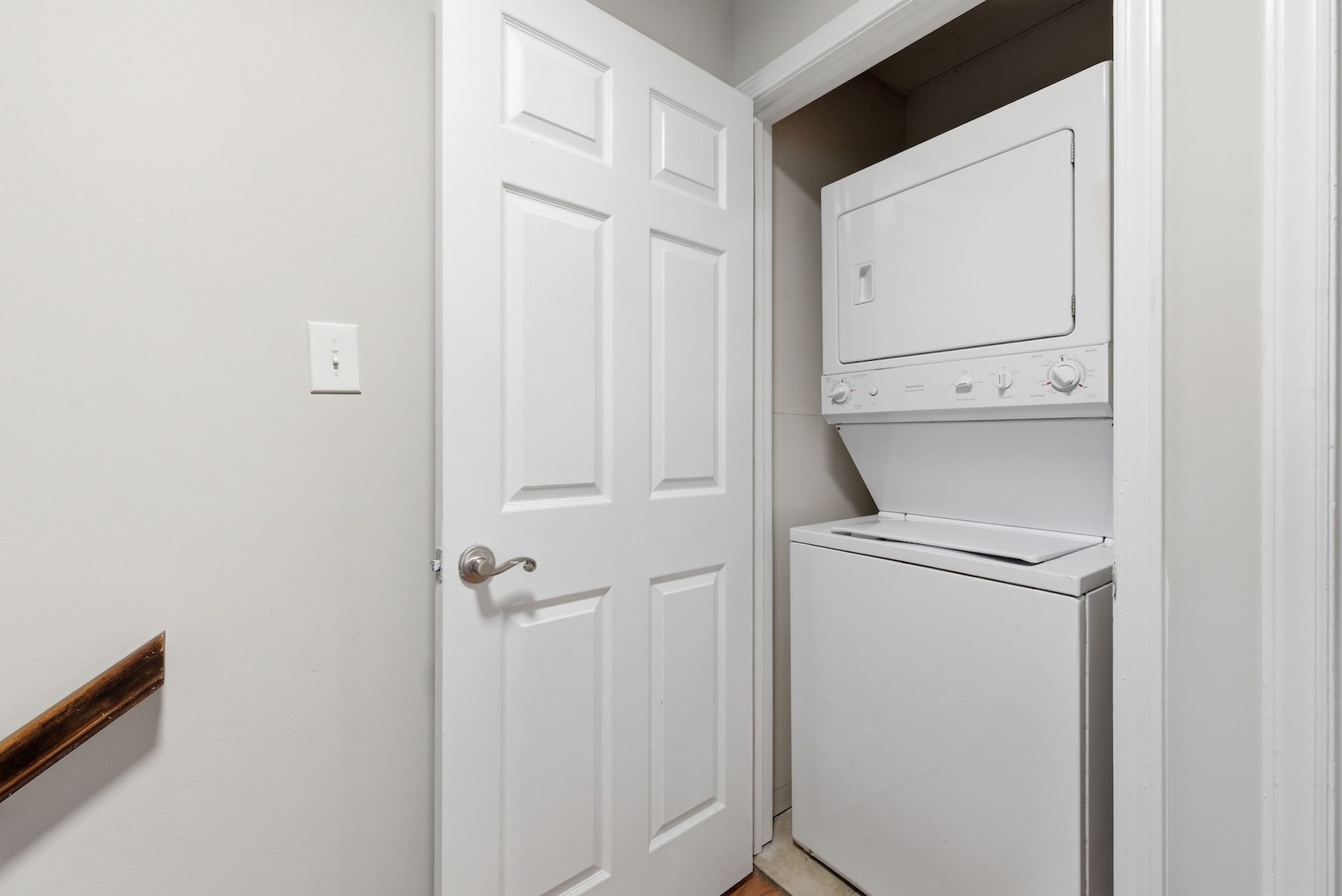 stacked washer and dryer in closet