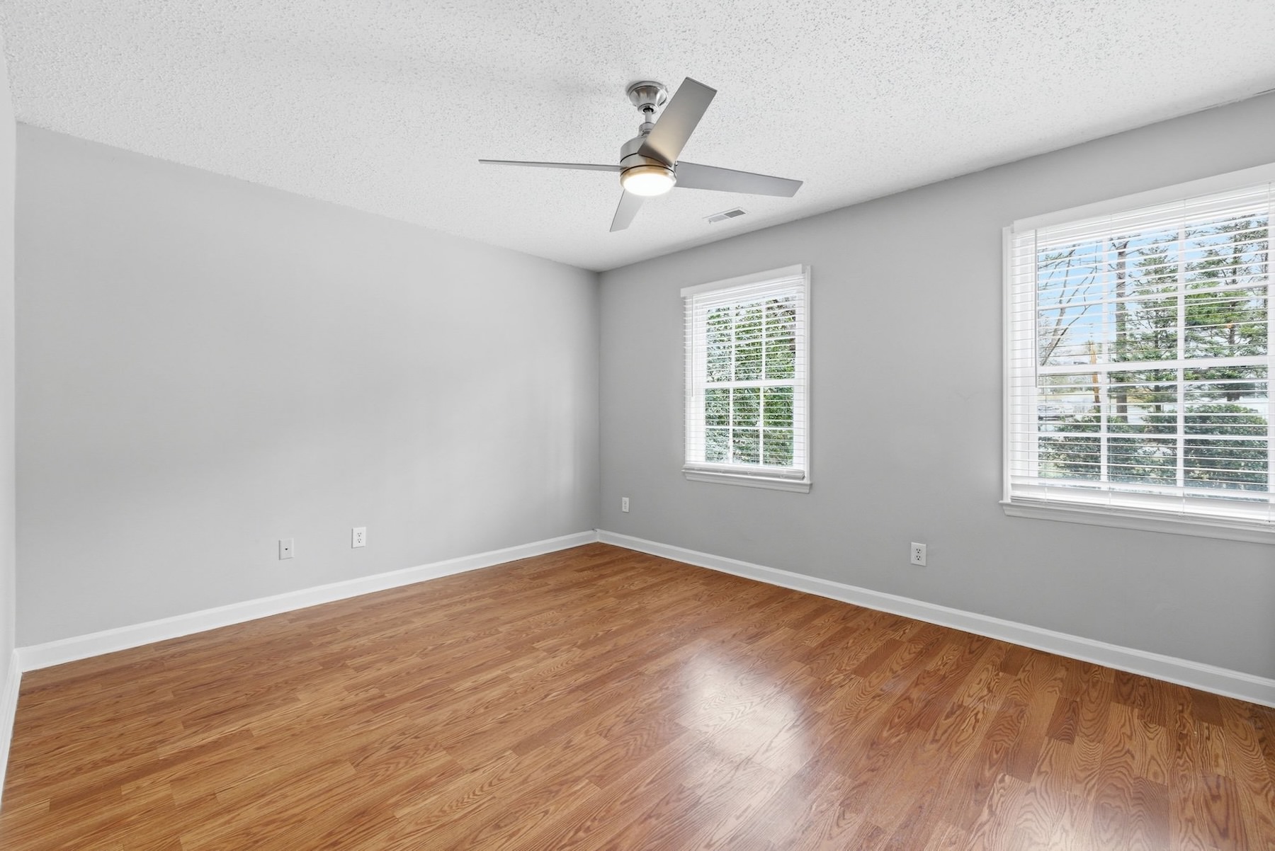 unfurnished bedroom with large windows