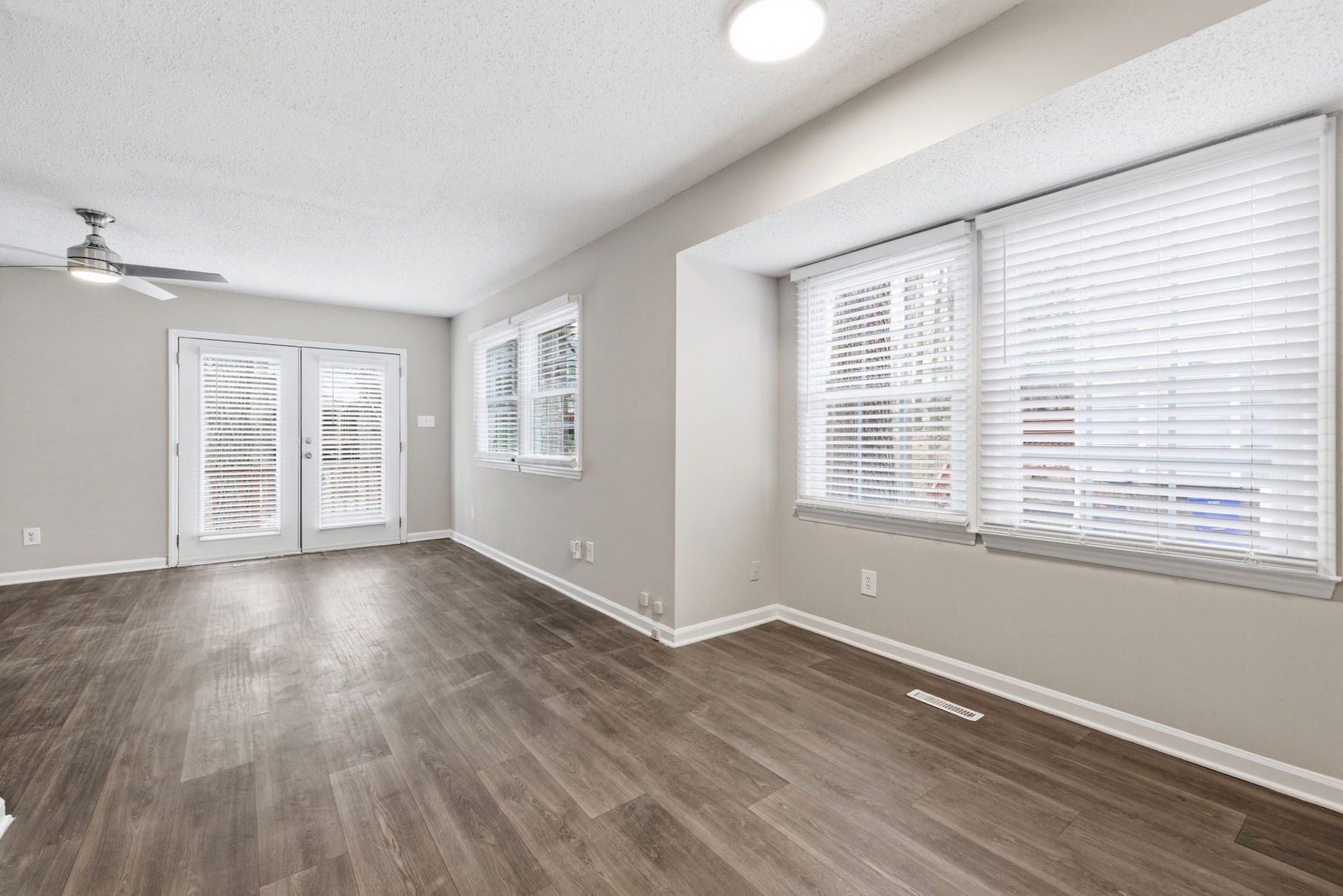 unfurnished living room with natural light