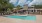a swimming pool in front of a building