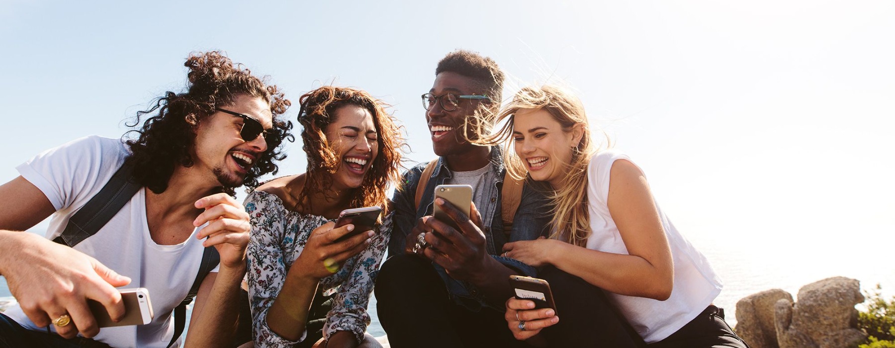 a group of  friends laughing and taking pictures