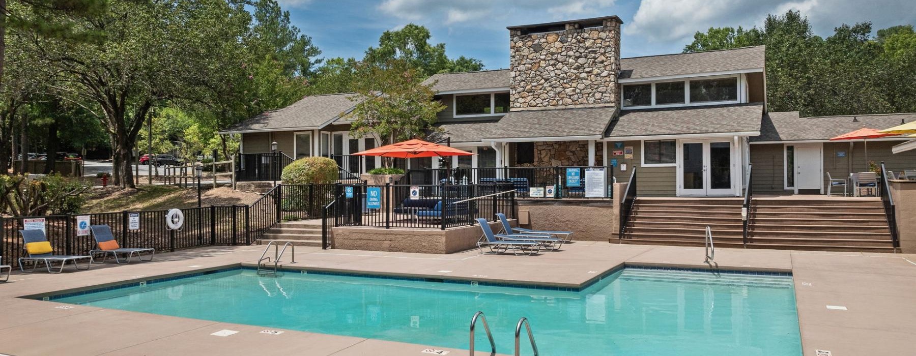 a swimming pool in front of a building
