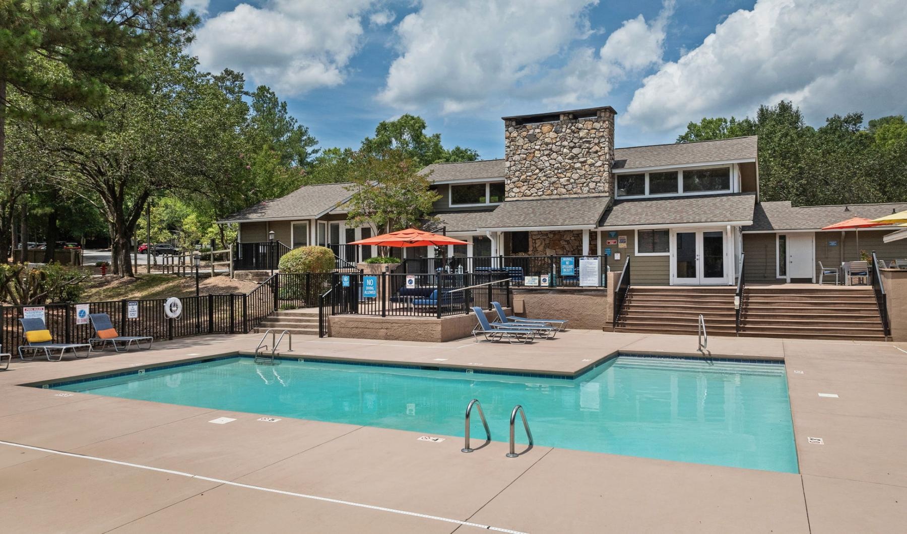 a swimming pool in front of a building